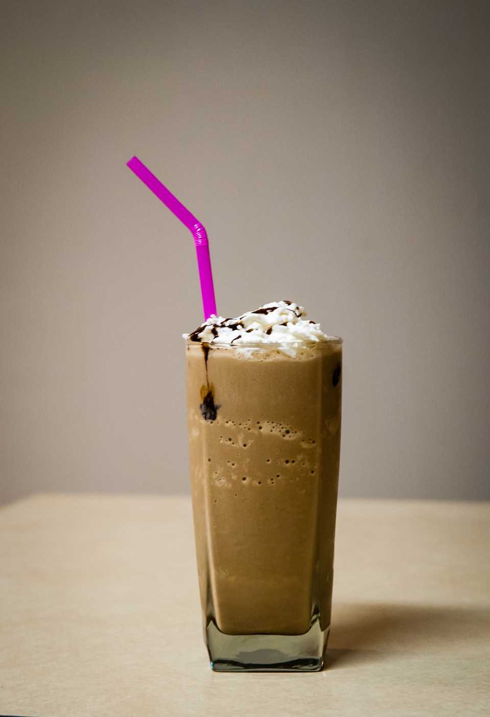 Cold coffee with a straw